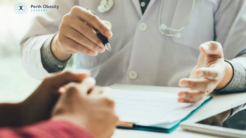 A doctor assessing a patient for bariatric surgery suitability.